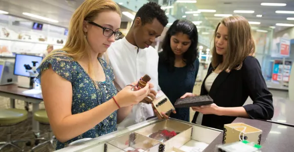 Students examine Museum collection objects as part of a Q?rius school program. Photo by Jennifer Renteria, Smithsonian.