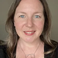 A woman smiling for a portrait photo