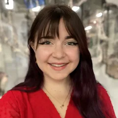 Image of woman with long black hair and red shirt