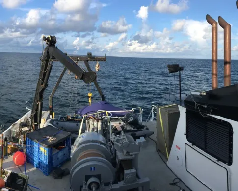 a view of the ocean from onboard a boat
