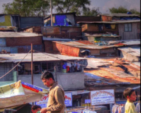people gathered outside small living quarters