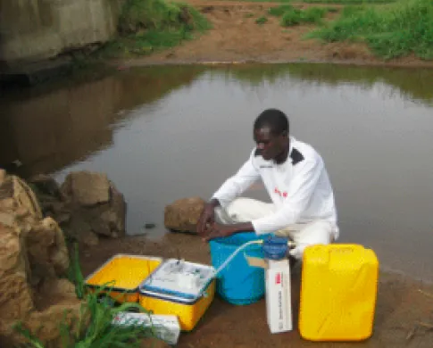 a scientist getting samples from water