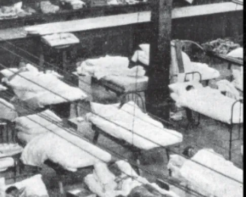 black and white photo of patients in hospital bed