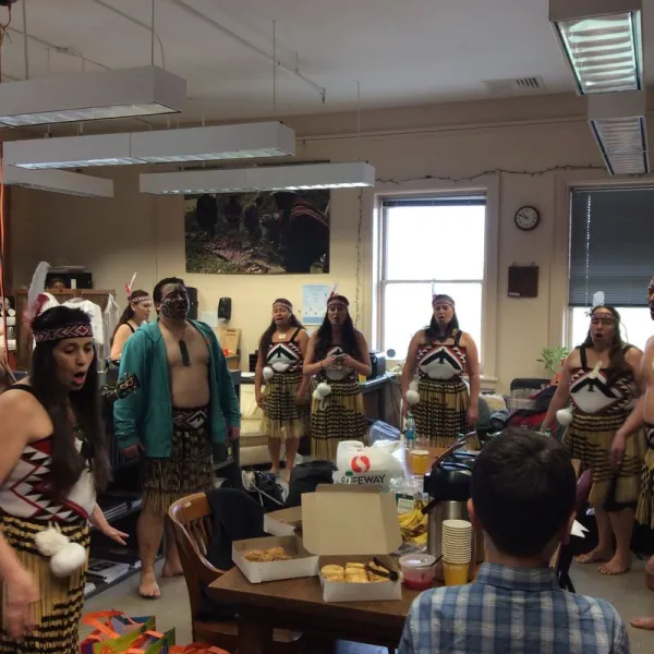 Māori group vocally warming up in the RV office.