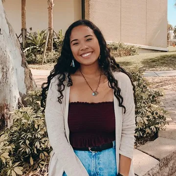 A smiling woman posing for a photo.