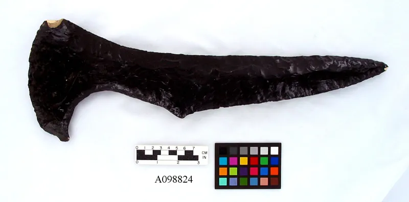 Black glass weapon shaped like a cutlass.