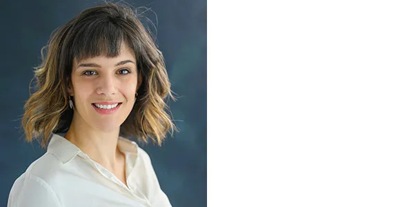 Portrait of Cecillia Garraffao, a light-skinned woman with neck-length brown hair with blonde highlights, who is wearing a white button-down shirt.