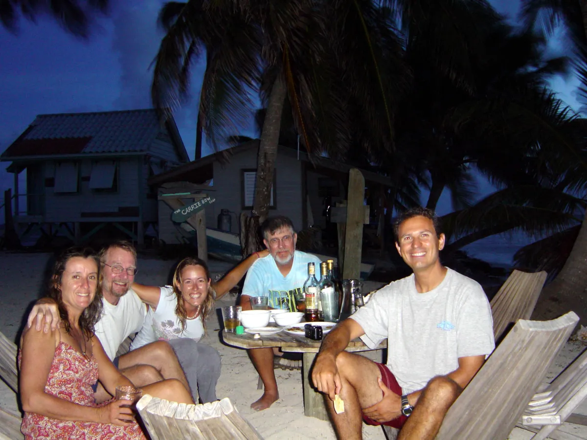 A group of people on the beach eating food