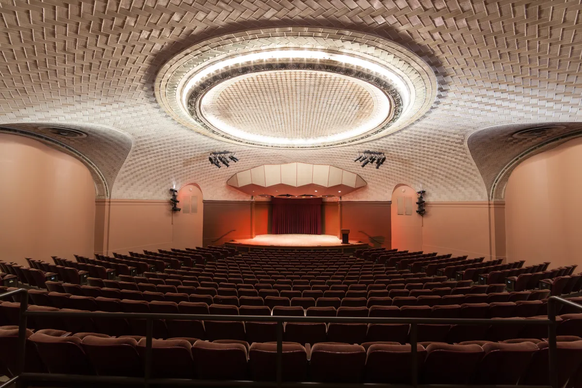 Baird Auditorium: Looking at the seats from the back of an empty Baird Auditorium towards the stage